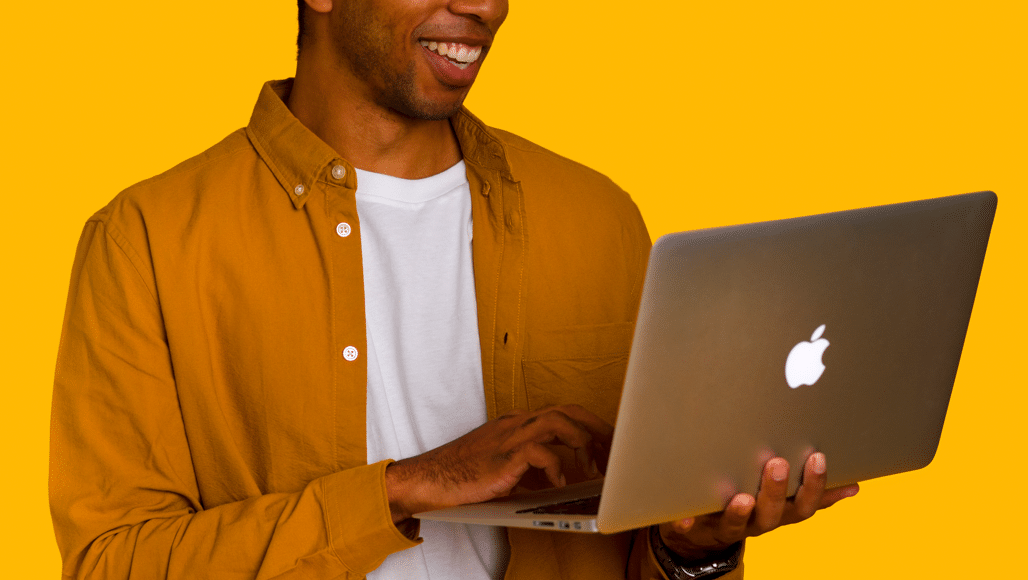 MeanPug Partner Mike Jones holding laptop