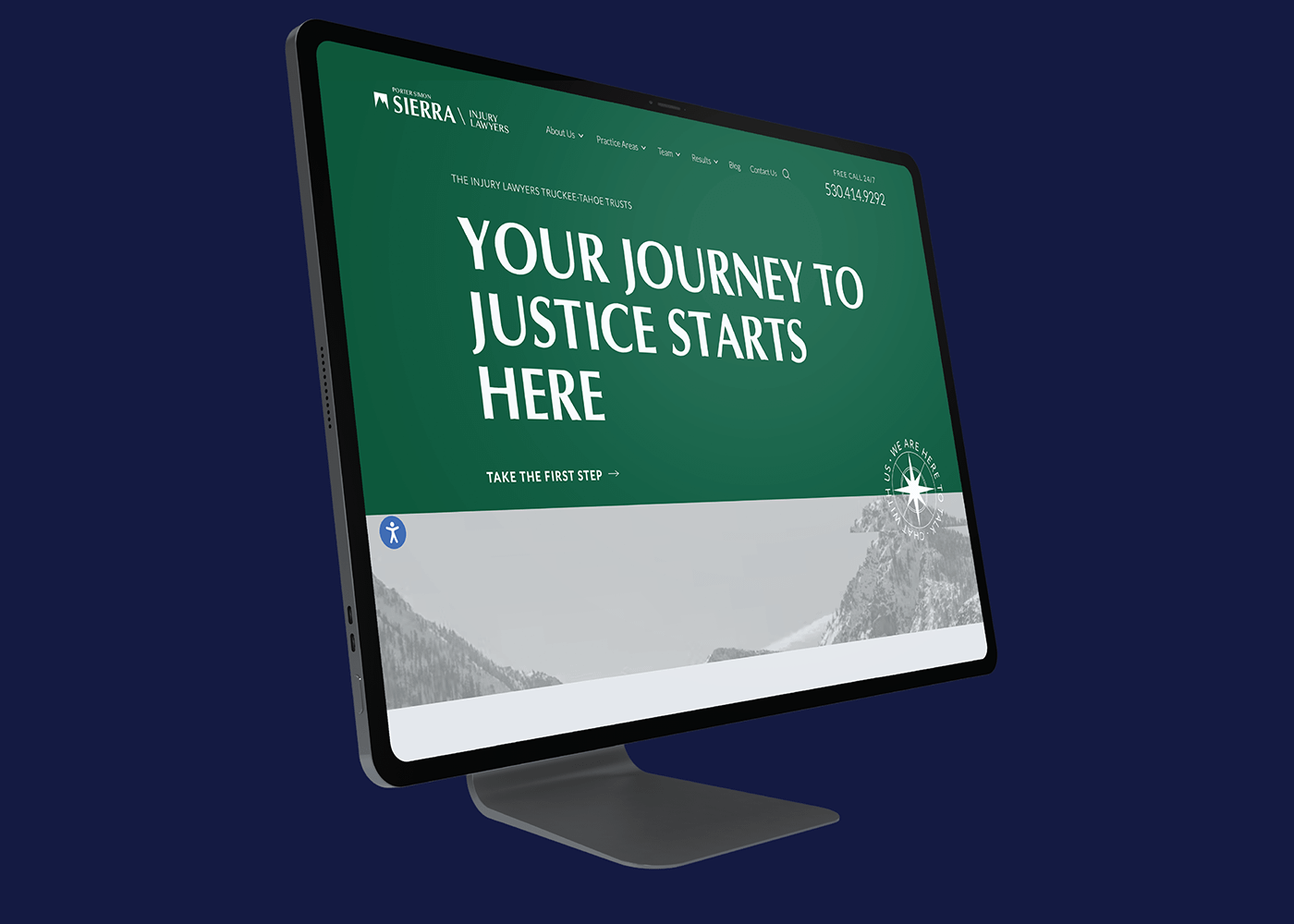 A computer monitor on a dark blue background displays a website for Porter Simon Sierra Injury Lawyers, with a green banner reading, "Your Journey to Justice Starts Here," conveying a welcoming tone.