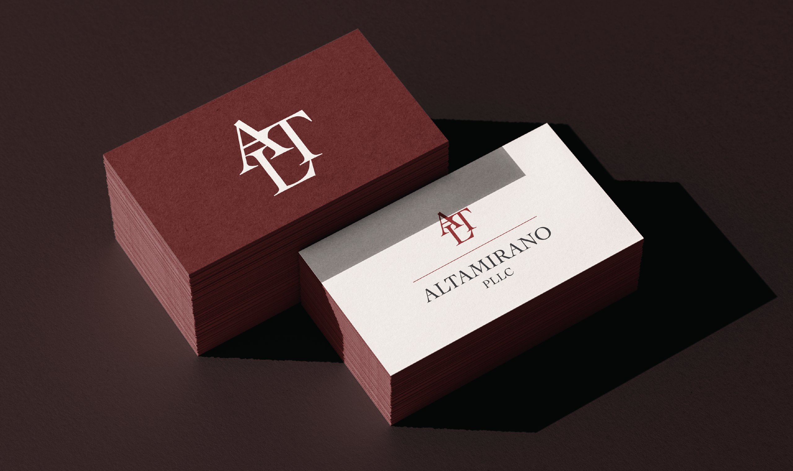 A stack of burgundy business cards with a white 