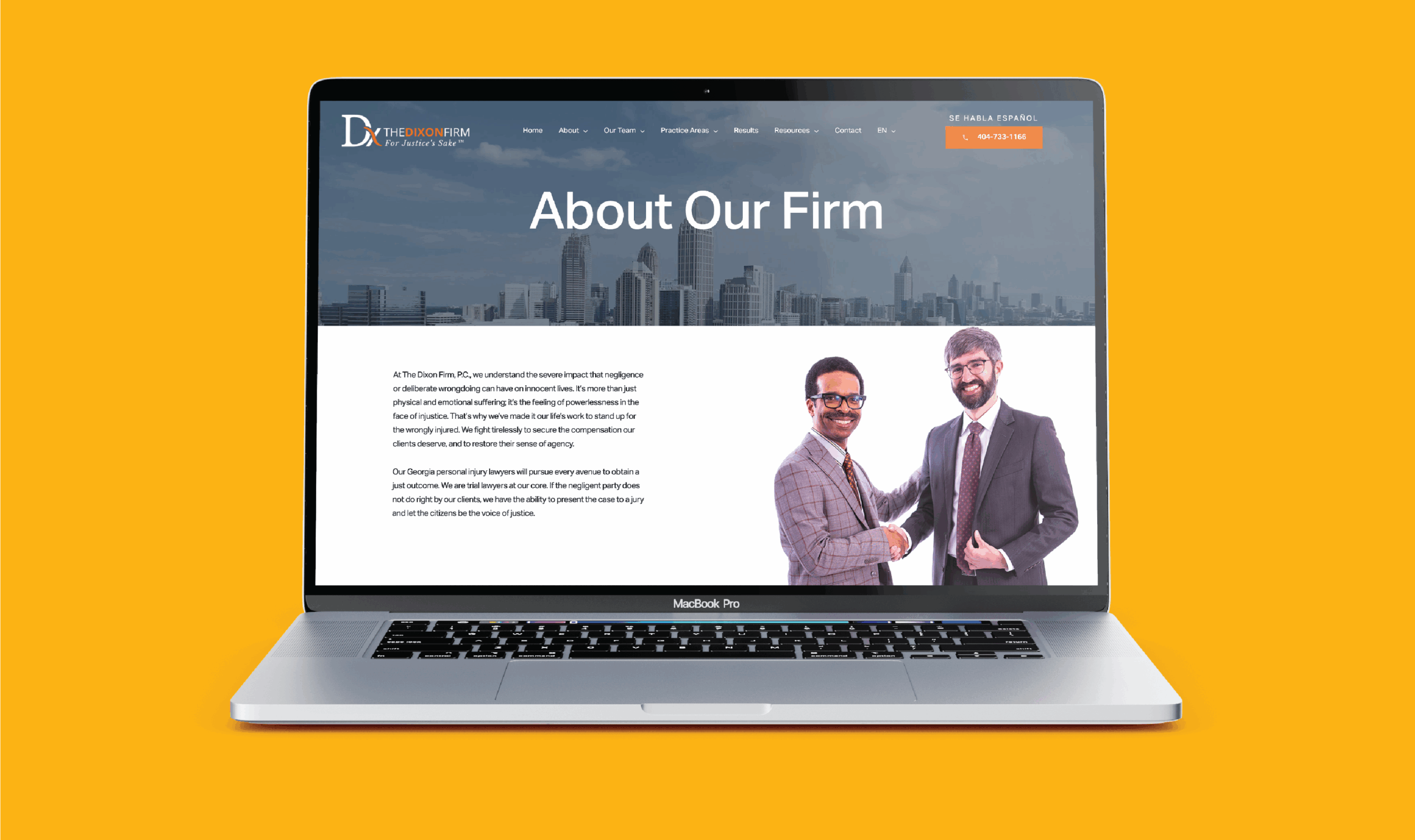 A laptop displays the older website for The Dixon Firm, titled 