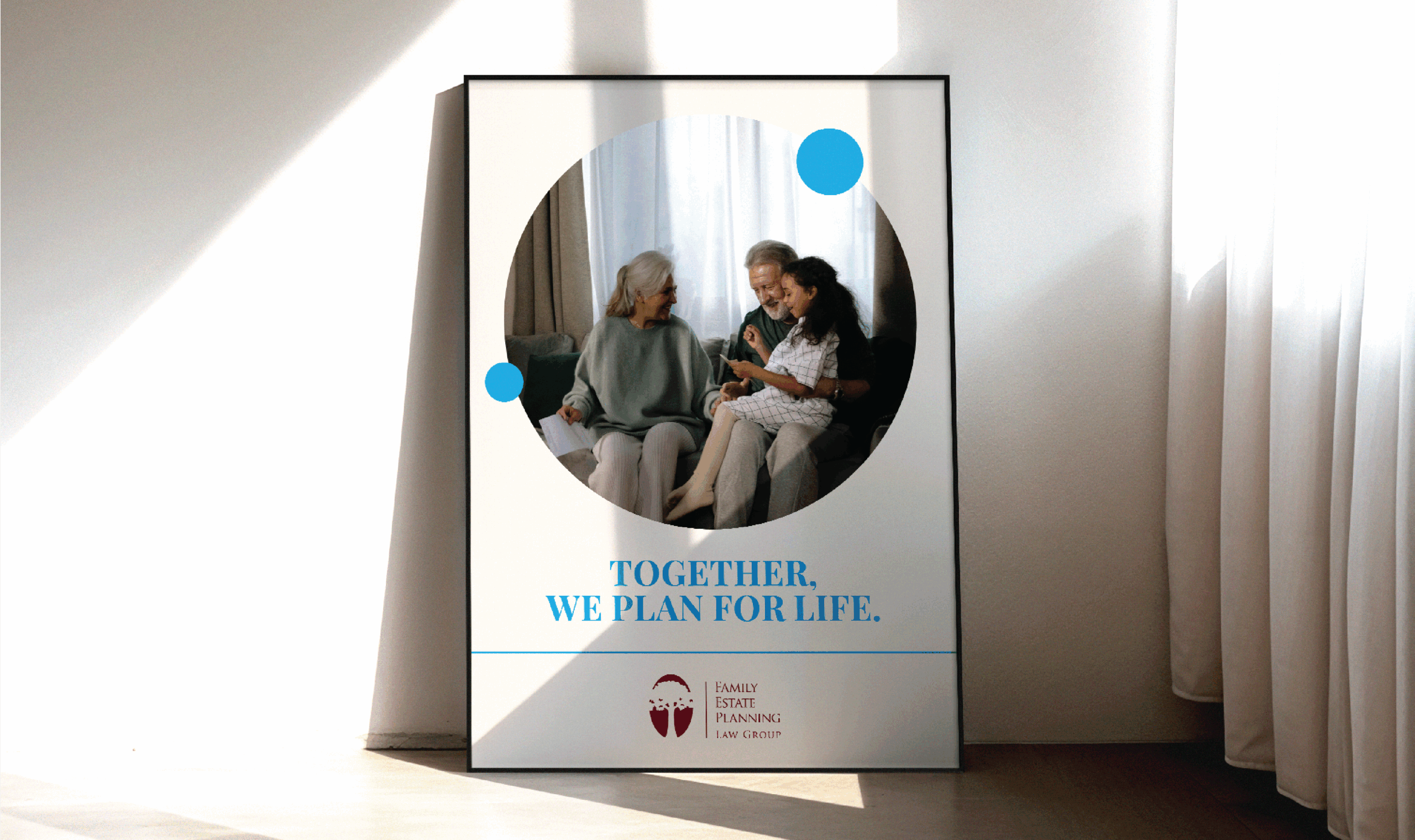 Framed poster with a joyful family sitting together, highlighting estate planning services. Text reads 