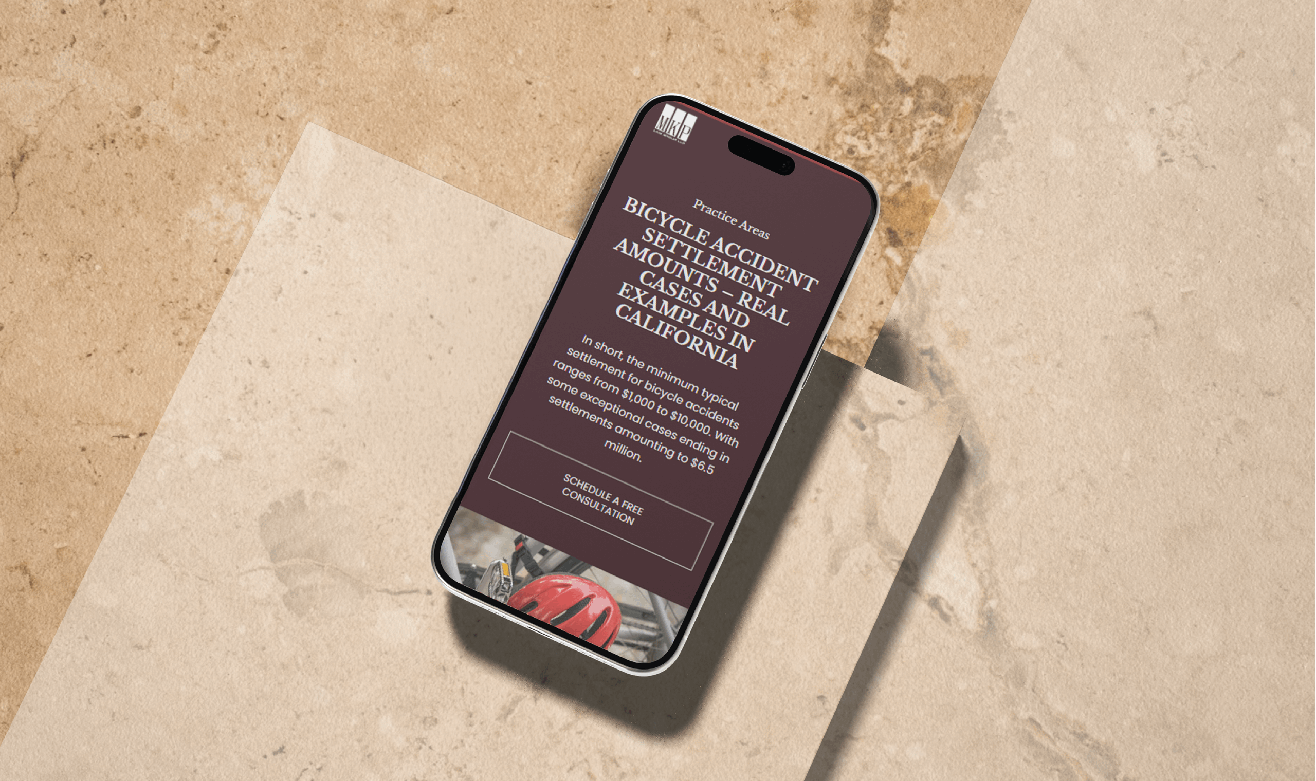 A smartphone displaying text on bicycle accident settlements in California is placed on a beige textured surface. The mood is informative and professional.