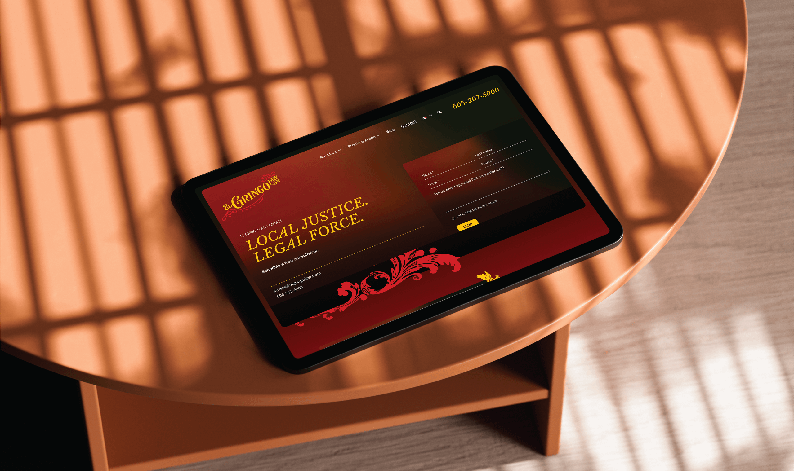 A tablet displaying the El Gringo Law website with a red and orange theme, featuring the text 