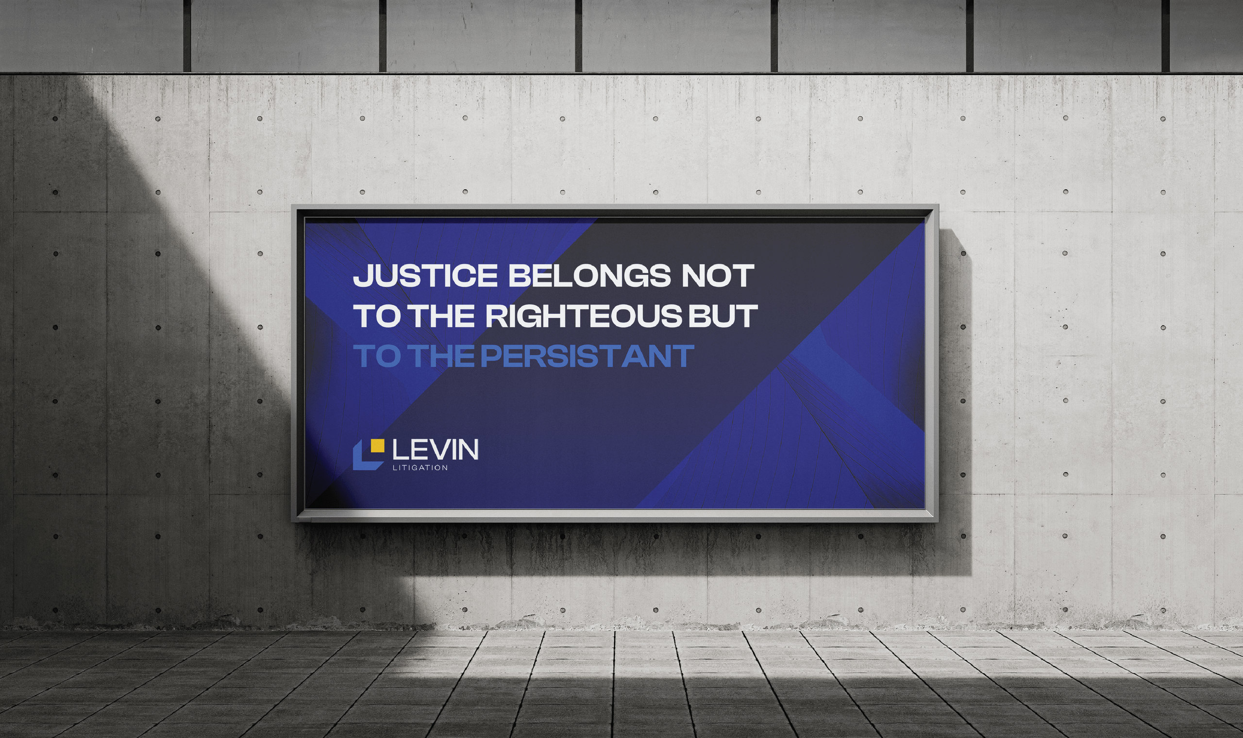 Billboard on a concrete wall displays text: 